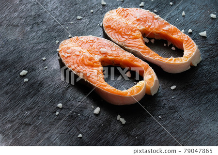 Fresh salmon fish fillet on wooden board 79047865