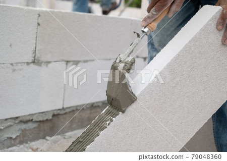 Bricklayer worker 79048360