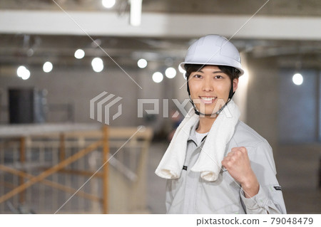 Portrait of a young man at a construction site 79048479