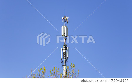 communication antennas, radio telephone mobile phone antennas on sky background 79048905