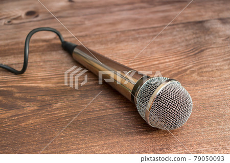 Silver microphone for professional sound recording or karaoke entertainment Silver microphone for professional sound recording or karaoke entertainment 79050093