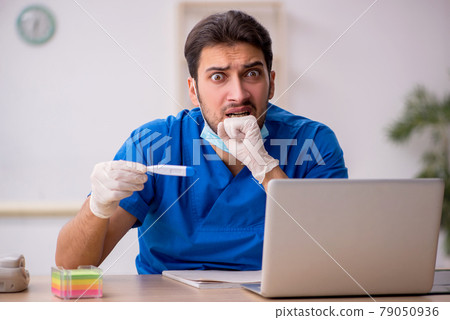 Young male doctor in vaccination concept Young male doctor in vaccination concept 79050936