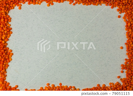 Top view on lentil seeds isolated on a white background.Lentils are rich in vegetable protein and are eaten since prehistoric times.Flat lay with copy space 79051115