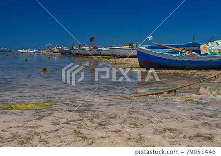 Beautiful view of the boat in the bay of the Mediterranean Sea at low tide on the island of Djerba, Tunisia 79051446