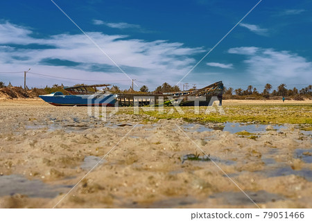 Beautiful view of a wrecked boat in the Mediterranean bay on the island of Djerba, Tunisia 79051466