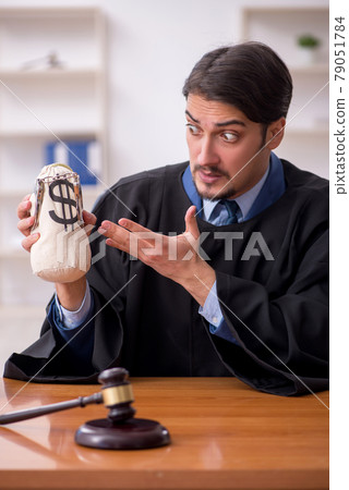 Young male judge working in the courtroom 79051784