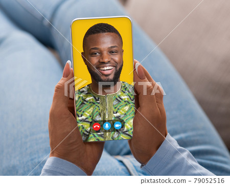 Young woman having online video conference with her boyfriend on smartphone at home. Remote communication 79052516