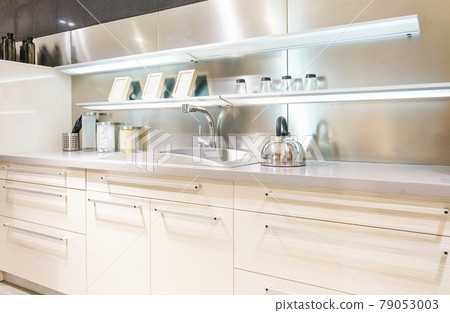 Bright modern kitchen with stainless steel appliances. Interior design. Bright modern kitchen with stainless steel appliances. Interior design. 79053003