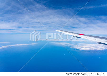Airplane in flight, aerial photography, high-altitude travel, sightseeing, Golden Week, sky, clouds, return to Japan, noon, morning aviation 79056134