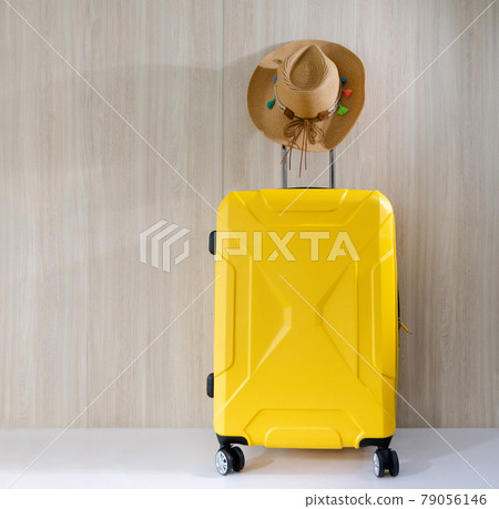 Travel yellow baggate and straw cowgirl hat 79056146