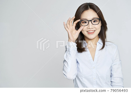 glasses, ophthalmology, young woman, business woman, career woman, nude, gray background 79056493
