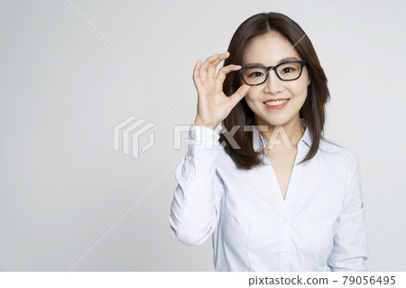 glasses, ophthalmology, young woman, business woman, career woman, nude, gray background 79056495