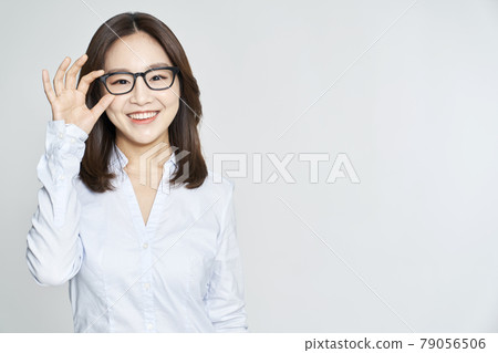 glasses, ophthalmology, young woman, business woman, career woman, nude, gray background 79056506