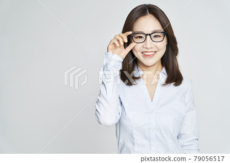 glasses, ophthalmology, young woman, business woman, career woman, nude, gray background 79056517