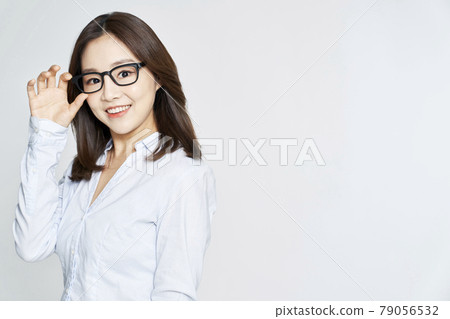 glasses, ophthalmology, young woman, business woman, career woman, nude, gray background 79056532