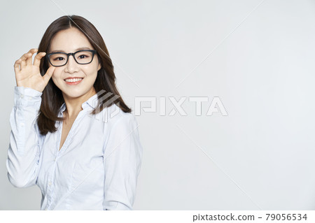 glasses, ophthalmology, young woman, business woman, career woman, nude, gray background 79056534