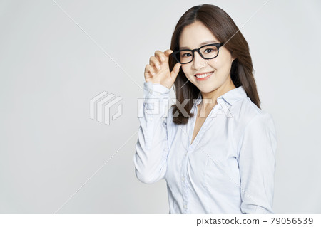 glasses, ophthalmology, young woman, business woman, career woman, nude, gray background 79056539
