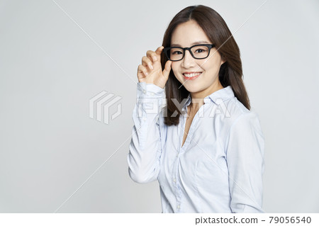 glasses, ophthalmology, young woman, business woman, career woman, nude, gray background glasses, ophthalmology, young woman, business woman, career woman, nude, gray background 79056540