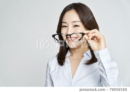 glasses, ophthalmology, young woman, business woman, career woman, nude, gray background 79056589