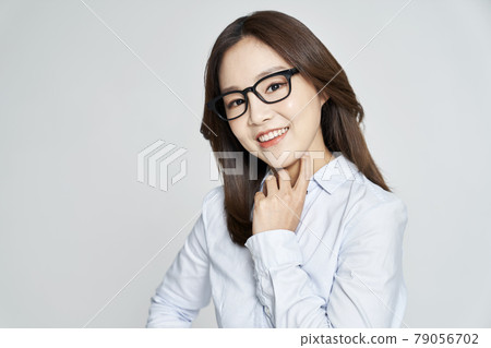 glasses, ophthalmology, young woman, business woman, career woman, nude, gray background 79056702