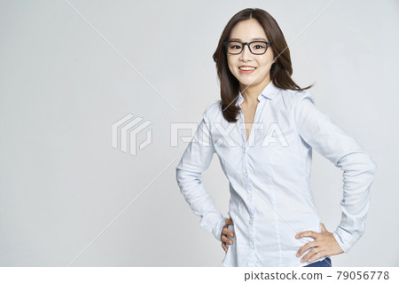 glasses, ophthalmology, young woman, business woman, career woman, nude, gray background 79056778