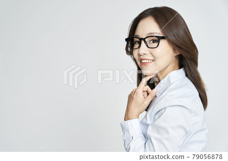 glasses, ophthalmology, young woman, business woman, career woman, nude, gray background glasses, ophthalmology, young woman, business woman, career woman, nude, gray background 79056878
