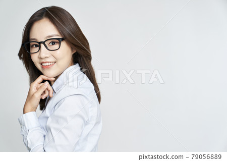 glasses, ophthalmology, young woman, business woman, career woman, nude, gray background 79056889