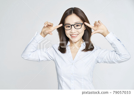 glasses, ophthalmology, young woman, business woman, career woman, nude, gray background 79057033