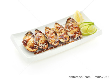mussels on a white plate with lemon isolated on a white background 79057052