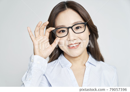 glasses, ophthalmology, young woman, business woman, career woman, nude, gray background 79057396