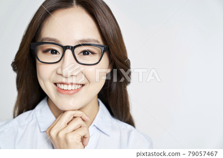 glasses, ophthalmology, young woman, business woman, career woman, nude, gray background 79057467