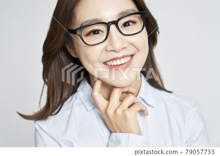 glasses, ophthalmology, young woman, business woman, career woman, nude, gray background 79057733