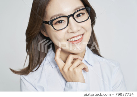 glasses, ophthalmology, young woman, business woman, career woman, nude, gray background 79057734