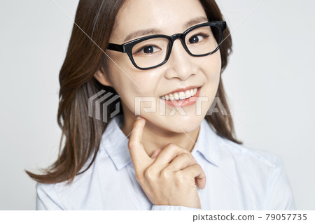 glasses, ophthalmology, young woman, business woman, career woman, nude, gray background 79057735