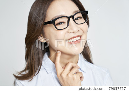 glasses, ophthalmology, young woman, business woman, career woman, nude, gray background 79057737