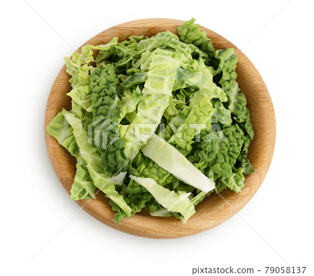 chopped savoy cabbage in wooden bowl isolated on white background with clipping path and full depth of field. Top view. Flat lay chopped savoy cabbage in wooden bowl isolated on white background with clipping path and full depth of field. Top view. Flat lay 79058137