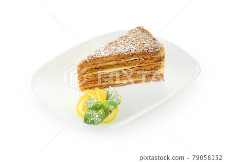 Cake Honey on a white plate Cake Honey on a white plate 79058152