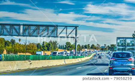 Cars on the freeway on a cloudy day Cars on the freeway on a cloudy day 79058259