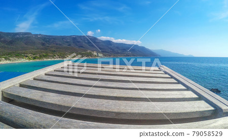 Wooden chair by the sea in Sardinia 79058529