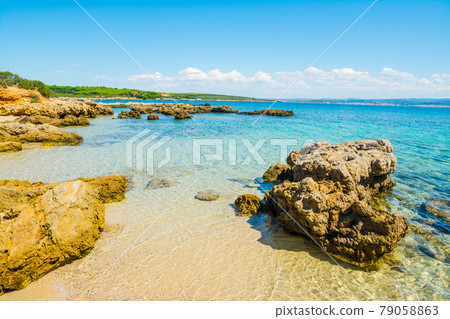 Rocks and sand in Alghero 79058863