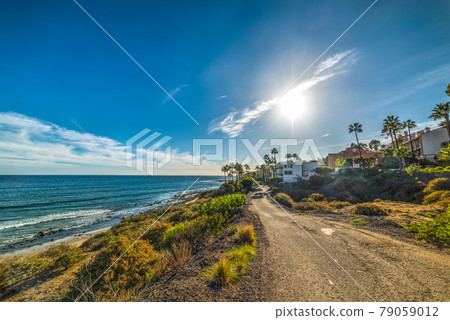 Sun shining over Malibu shoreline Sun shining over Malibu shoreline 79059012