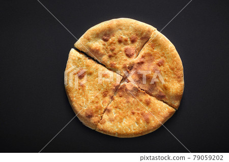 Traditional Khachapuri on black stone background 79059202
