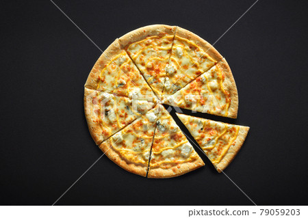Pizza with cheese feta parmesan mozzarella dor blu on a black stone background Pizza with cheese feta parmesan mozzarella dor blu on a black stone background 79059203