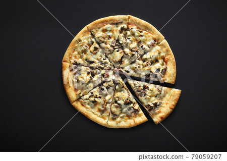 Pizza with raw minced meat on a black stone background 79059207