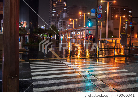 Pedestrian crossing on a rainy night 79060341