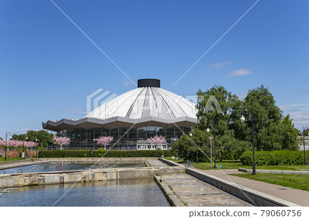 View over the Moscow State Circus on Vernadskogo Prospekt with blooming spring trees, sunny day, Russia View over the Moscow State Circus on Vernadskogo Prospekt with blooming spring trees, sunny day, Russia 79060756