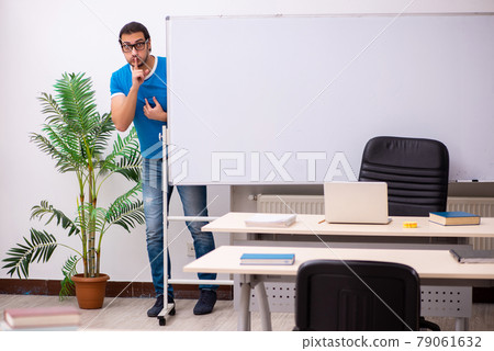 Young male student in the classroom Young male student in the classroom 79061632