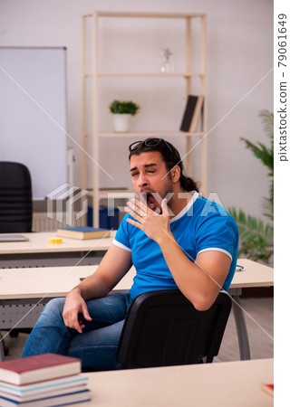 Young male student in the classroom 79061649