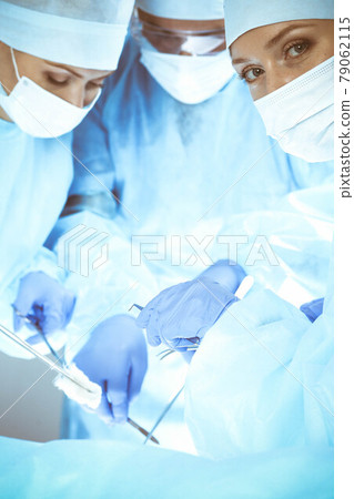A group of surgeons is operating at the hospital. Health care concept A group of surgeons is operating at the hospital. Health care concept 79062115