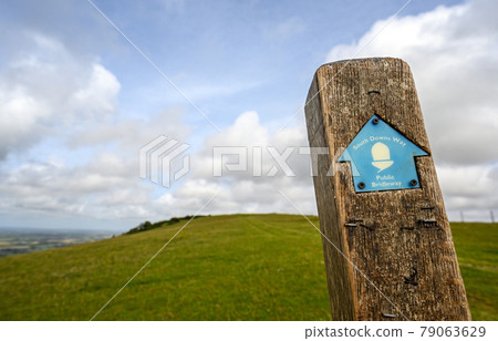 South Downs National Park, Sussex, UK near Firle Beacon. A signpost shows the route of the South Downs Way towards Firle Beacon. The South Downs Way is a national trail popular with walkers. South Downs National Park, Sussex, UK near Firle Beacon. A signpost shows the route of the South Downs Way towards Firle Beacon. The South Downs Way is a national trail popular with walkers. 79063629